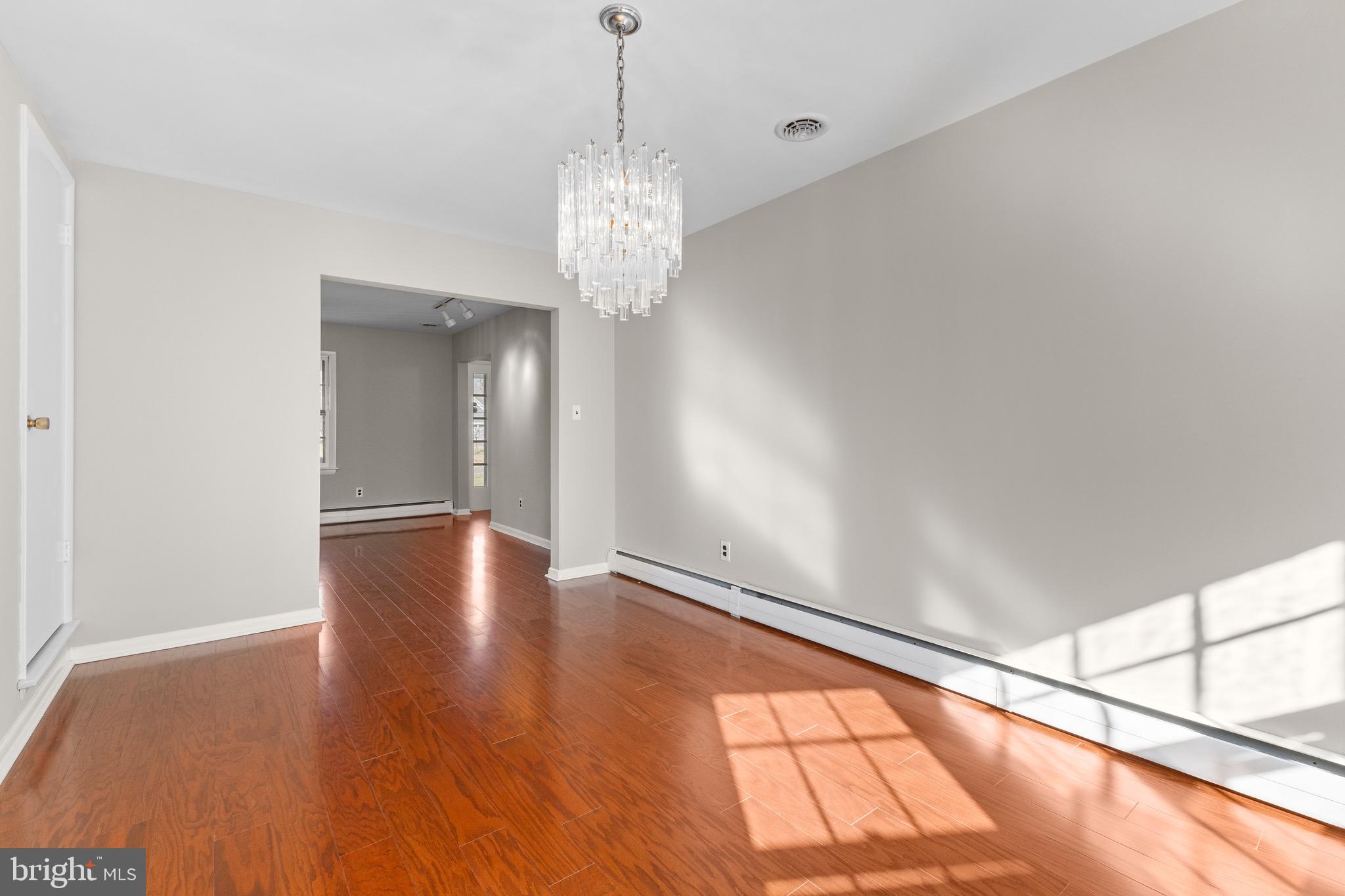 412 Vierling Drive Silver Spring, MD 20904 - Photo 23 of 35 a view of an empty room with wooden floor and a window