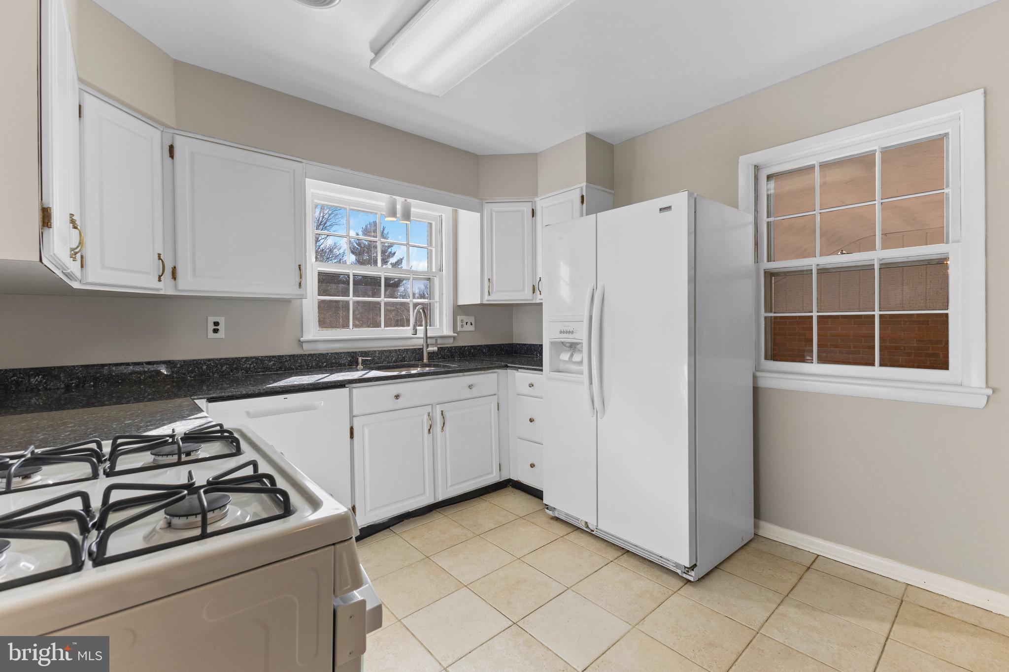 412 Vierling Drive Silver Spring, MD 20904 - Photo 24 of 35 a kitchen with appliances cabinets and a window