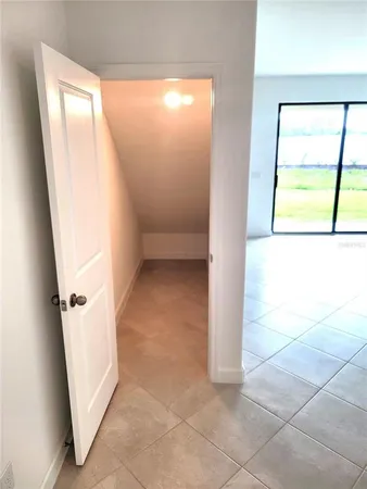 a view of an empty room with a window