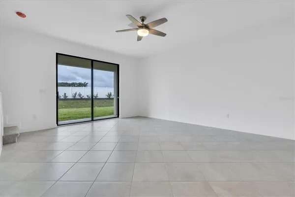 a view of a kitchen with a sink and cabinets