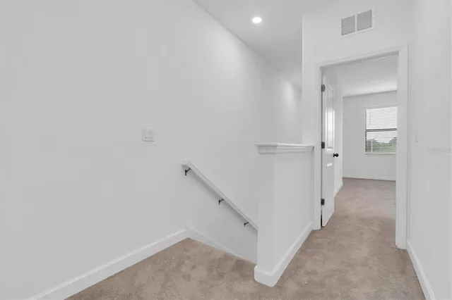 a spacious bathroom with a granite countertop sink mirror and shower