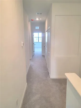 a bathroom with a granite countertop shower and a sink