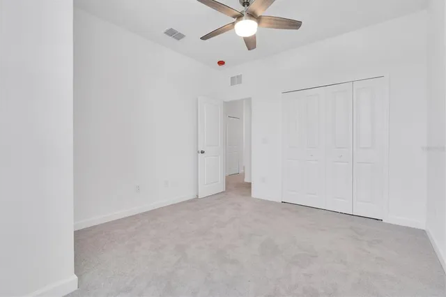 a view of a house with backyard and porch