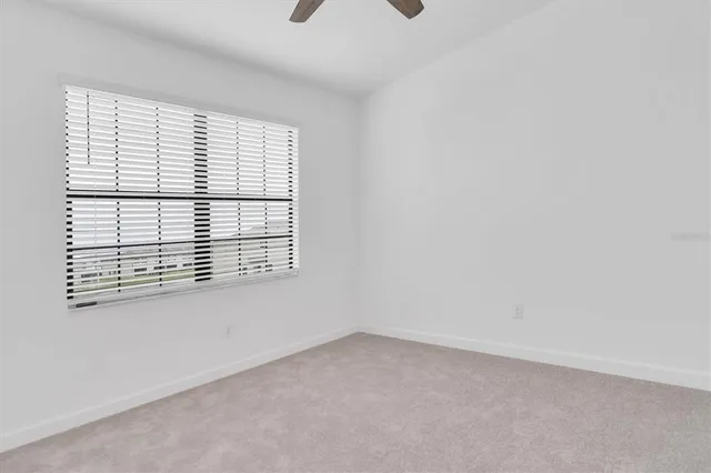 a bathroom with a shower and sink
