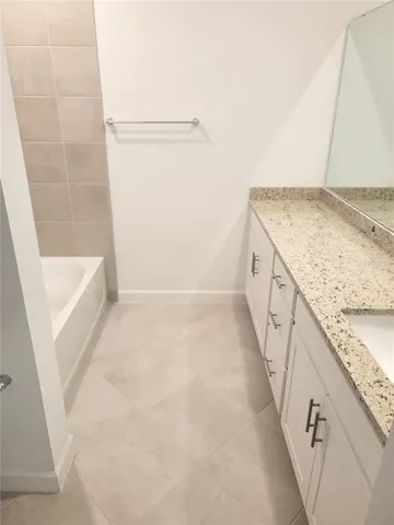 an aerial view of a house with a lake view