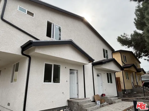 a front view of a house with parking