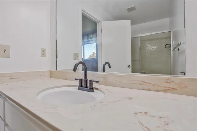 a bathroom with a sink and a mirror