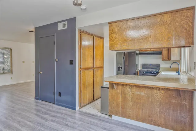 a living room with a fireplace furniture and a large window