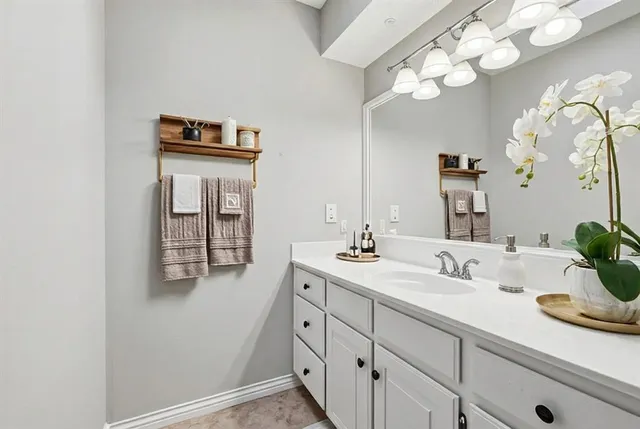a bathroom with a sink and a mirror