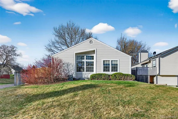 a view of front of house with a yard