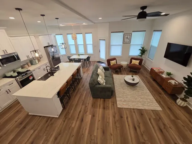 a living room with furniture and a flat screen tv