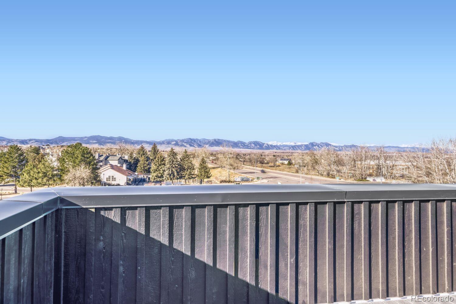 9195 Pierce Street, Unit 2 Westminster, CO 80021 - Photo 27 of 28 a view of city and mountain from a balcony