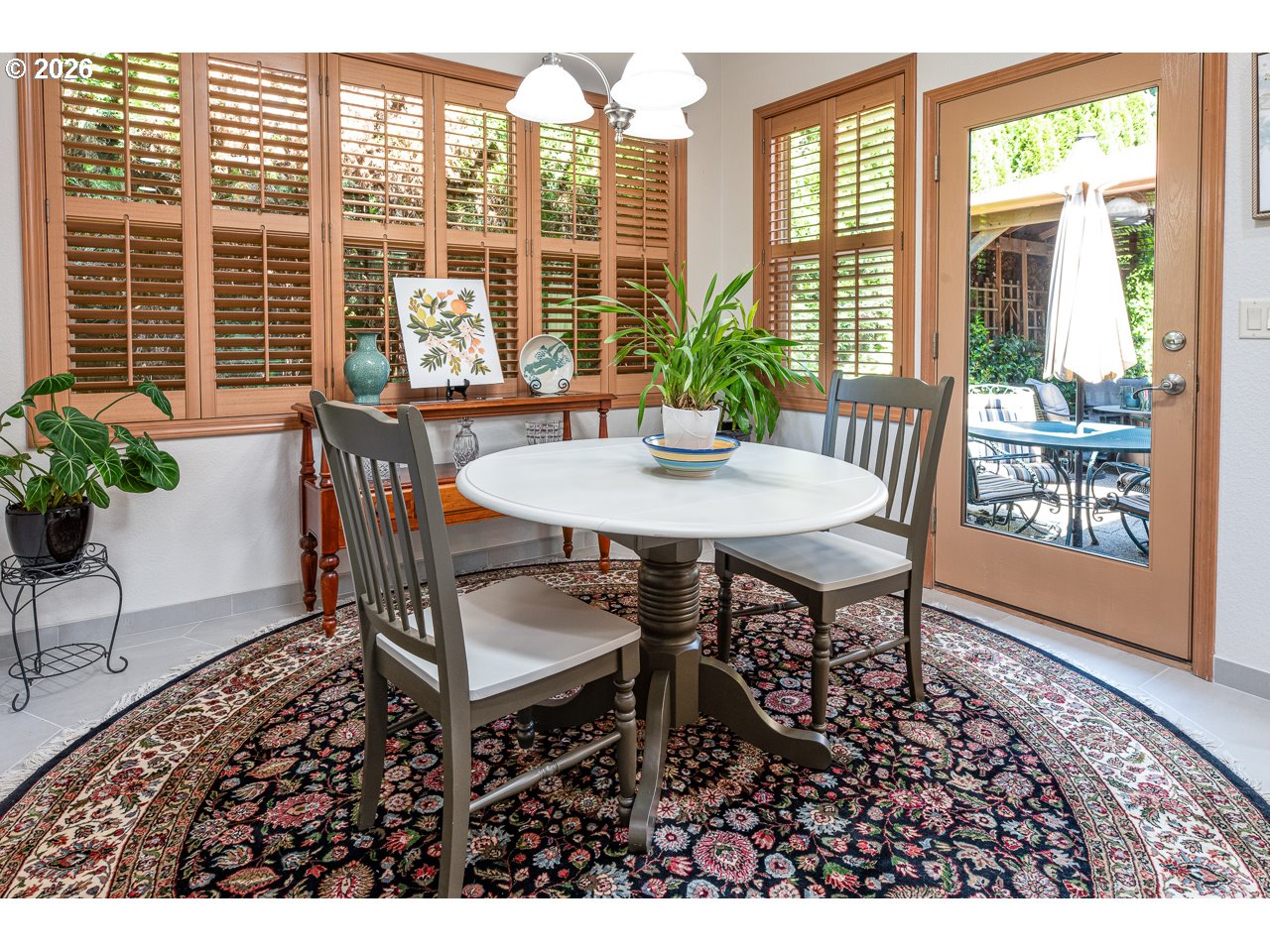 3381 Rosemont Way Eugene, OR 97401 - Photo 21 of 45 a view of a dining room with furniture window and wooden floor