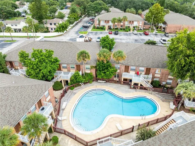 an aerial view of a house with outdoor space patio and swimming pool