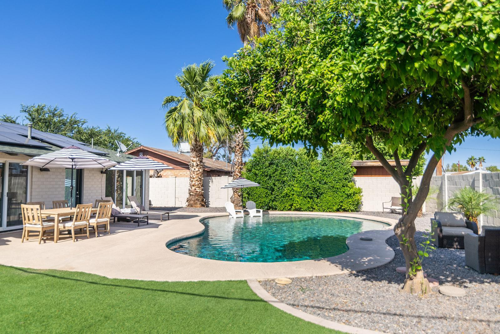 7435 East Granada Road Scottsdale, AZ 85257 - Photo 3 of 28 a view of a house with backyard porch and sitting area