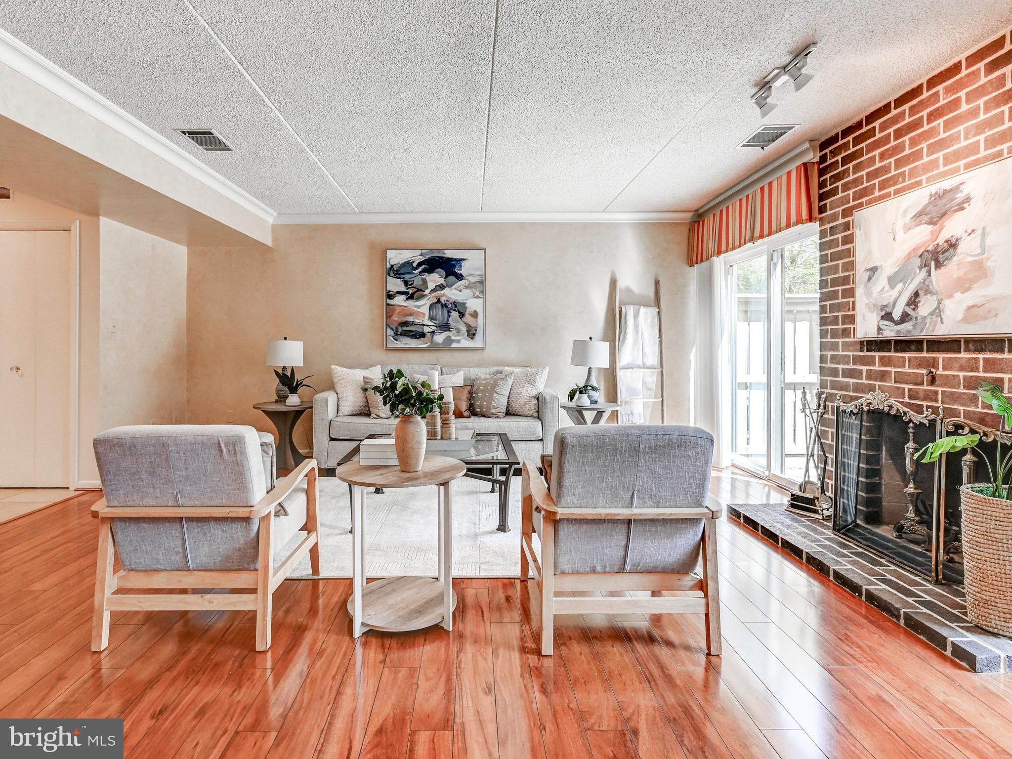 17 Pacers Lane, Unit F Pikesville, MD 21208 - Photo 11 of 24 Wood-burning fireplace in Living Room
