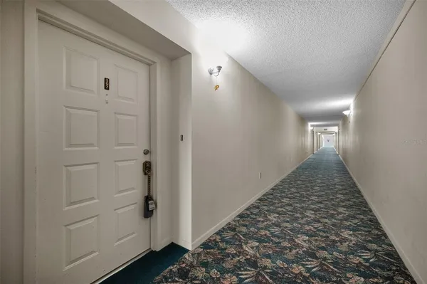 a view of a hallway view with staircase