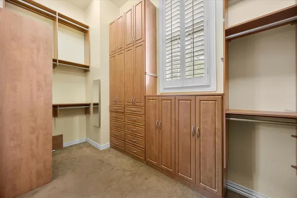 a view of walk in closet with window