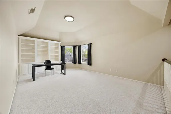 a view of workspace with furniture and window