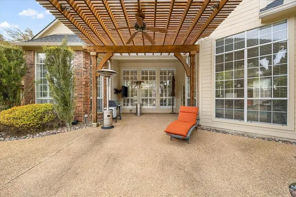 a view of a room with wooden floor and windows