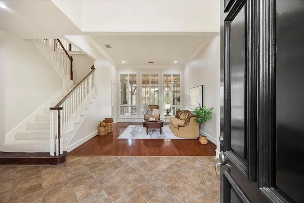 a view of a living room and entryway