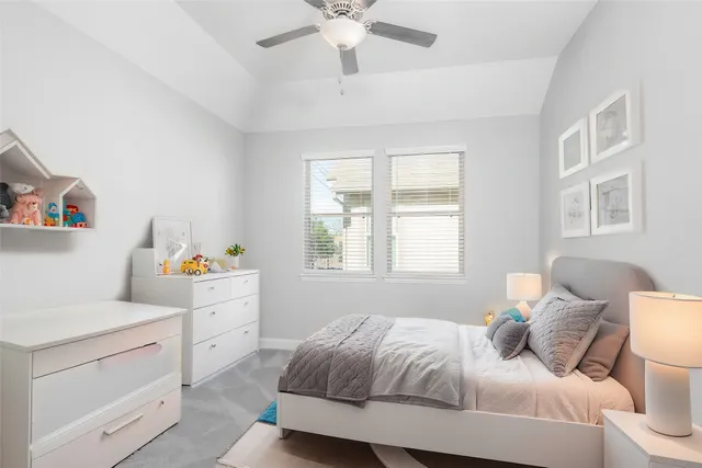 a bedroom with a bed and a cabinets