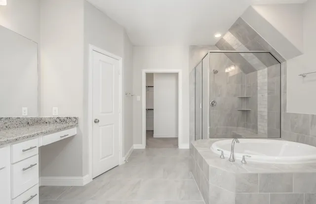 a bathroom with a bathtub and a sink