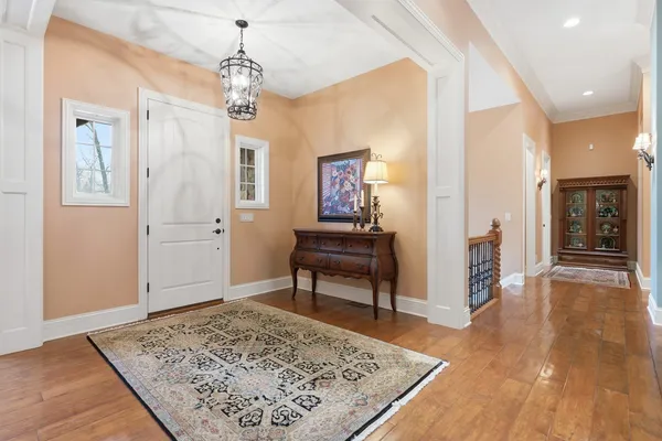 a view of a livingroom with wooden floor and a rug