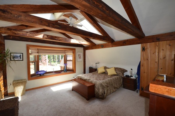 34 Chestnut Hill Road Leverett, MA 01054 - Photo 12 of 29 a spacious bedroom with a bed and a large window