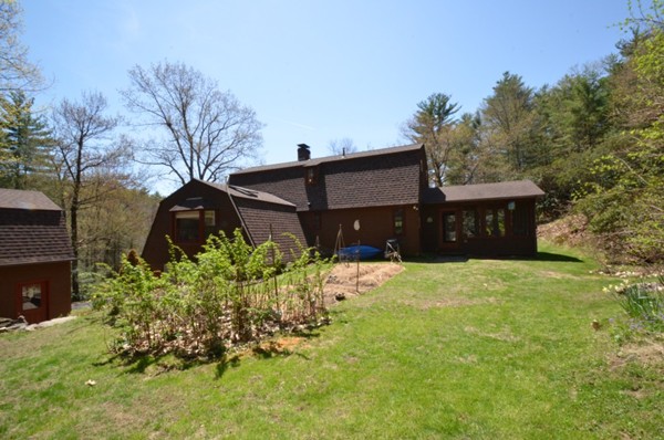 34 Chestnut Hill Road Leverett, MA 01054 - Photo 20 of 29 a front view of a house with a yard