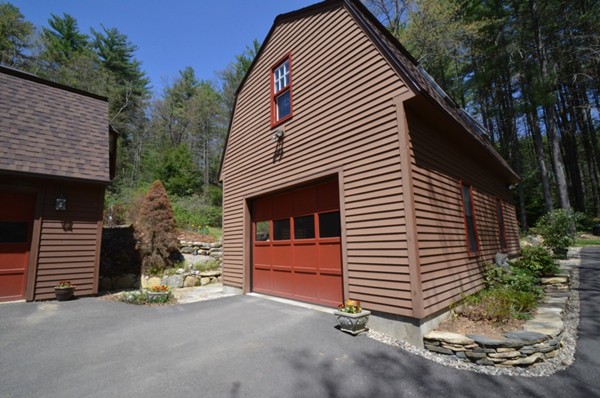 34 Chestnut Hill Road Leverett, MA 01054 - Photo 21 of 29 a view of a house with a yard and garage
