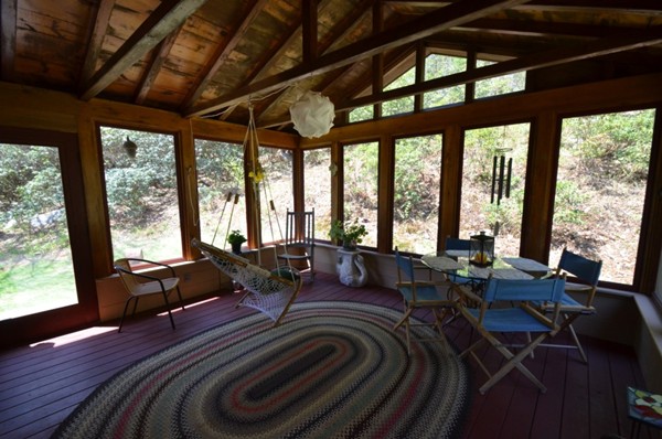34 Chestnut Hill Road Leverett, MA 01054 - Photo 28 of 29 a living room with furniture large windows and wooden floor