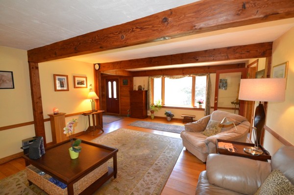 34 Chestnut Hill Road Leverett, MA 01054 - Photo 7 of 29 a living room with furniture a window and a lamp