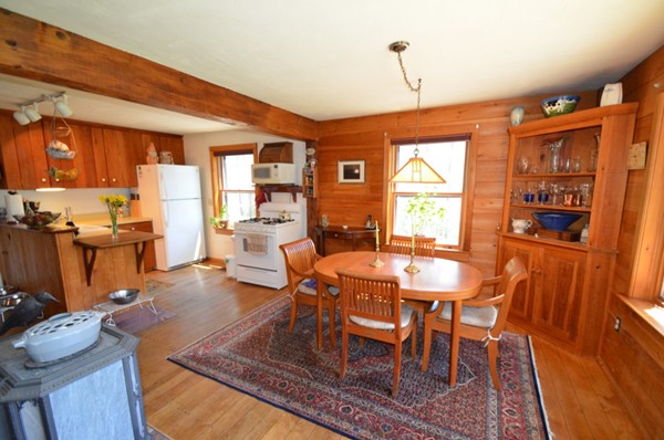 34 Chestnut Hill Road Leverett, MA 01054 - Photo 10 of 29 a dining room with furniture a chandelier and wooden floor
