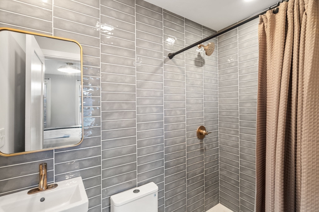 10 Lamson Court, Unit 2 Boston, MA 02128 - Photo 9 of 10 a bathroom with a shower