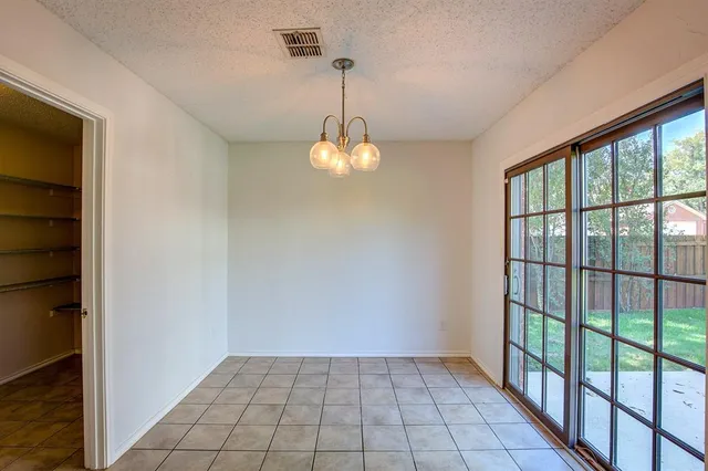 a view of a hallway with windows