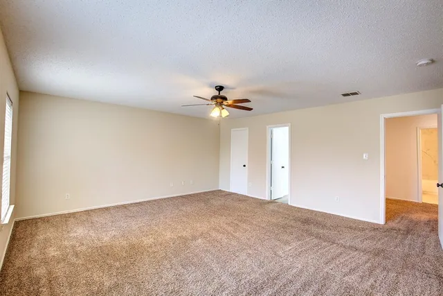 a view of a livingroom with a ceiling fan
