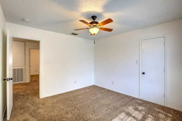 a view of a chandelier fan in a room