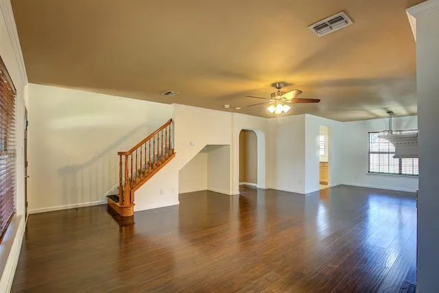 a view of an entryway with wooden floor