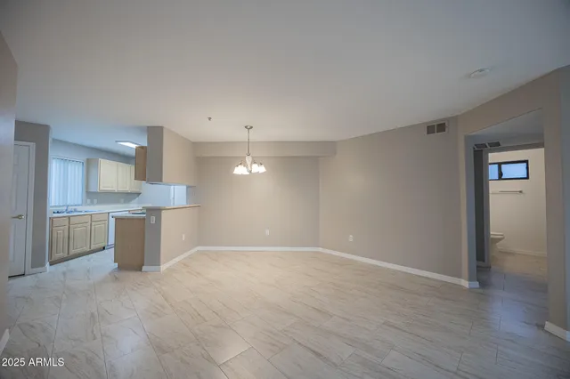 a view of a kitchen with a sink and a stove
