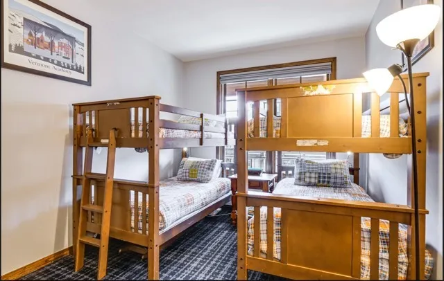 a bedroom with furniture and window