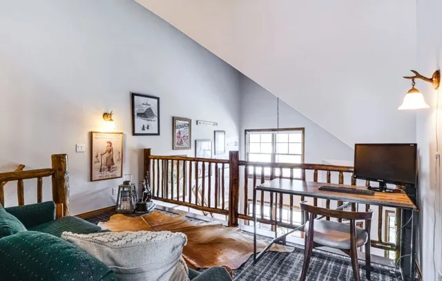 a bedroom with furniture and a window