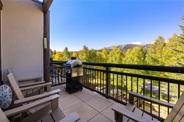 a view of barbeque grill with seating area