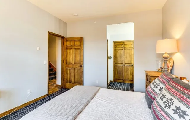 a bathroom with a toilet tub and shower