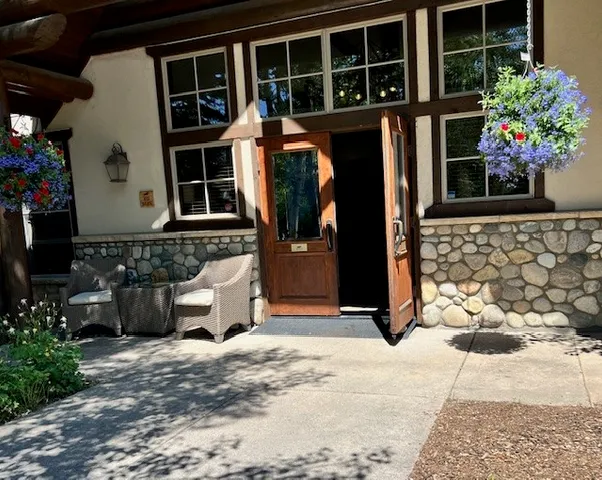 a view of a hallway with wooden shelves