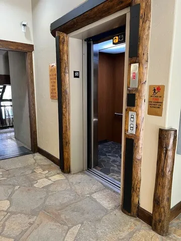 a living room with furniture pool and a table