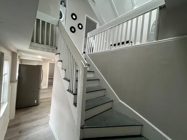a view of entryway with wooden floor