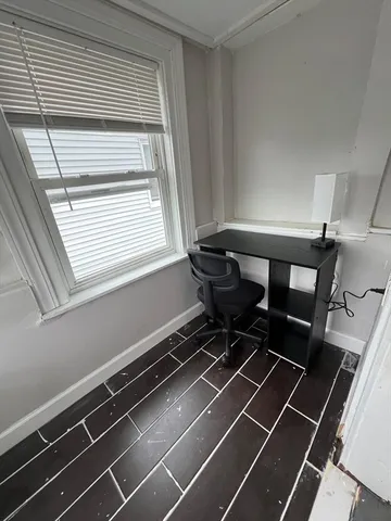 a picture of a room with furniture and windows