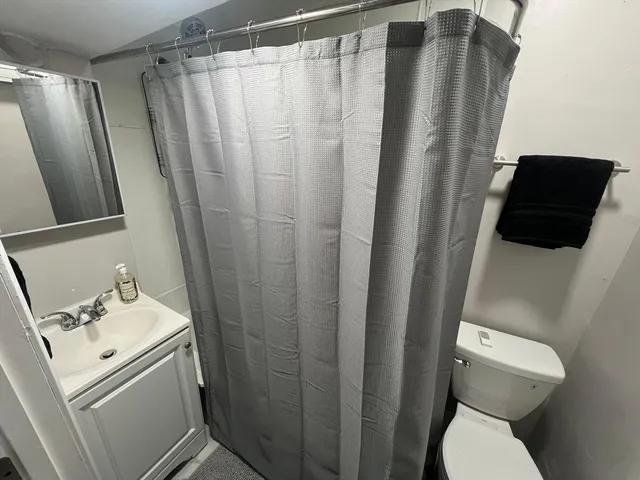 a bathroom with sink and mirror