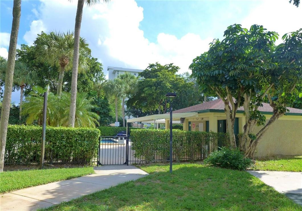 3095 North Course Drive, Unit 1005 Pompano Beach, FL 33069 - Photo 23 of 32 Entry to Pool Area